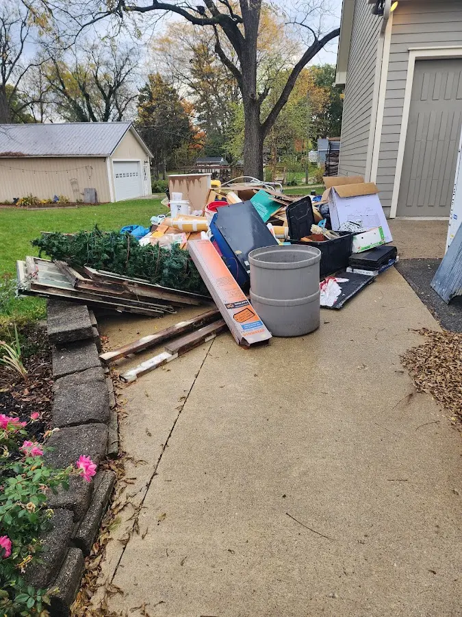 Dumpster being loaded with debris for 3 Yard Dumpster Rental in Orangeville